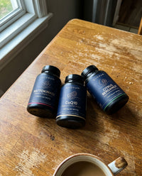 Customer holding three Heart Stack bottles